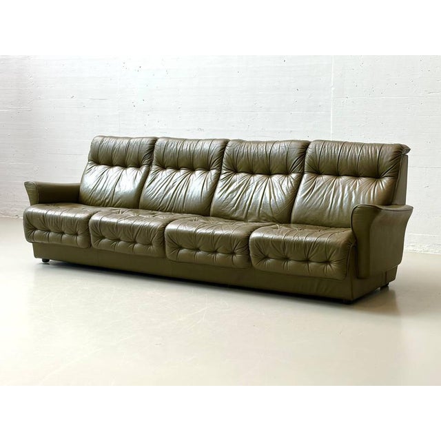 A striking 4-seater leather sofa from the 1970s with a distinctive design and exceptional seating comfort. The softly...