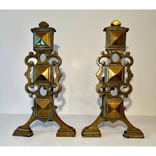 A pair of very handsome Brass Andirons. The pair are uniquely designed and are a modern translation, while many andirons...