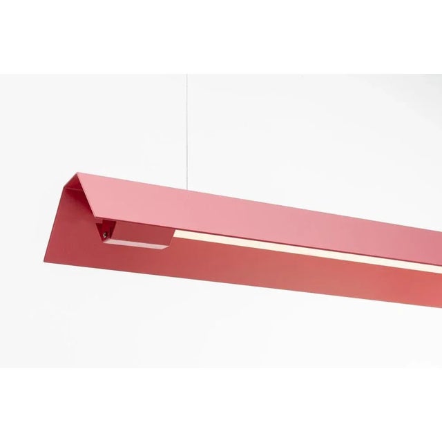 Large misalliance ral antique pink suspended light by lexavala dimensions: d 16 x w 130 x h 8 cm materials: powder coated...