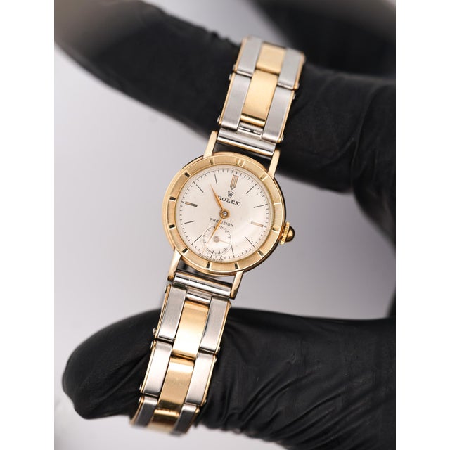 Vintage Rolex Precision ladies manual wind watch in two-tone yellow gold and stainless steel, featuring a 22mm round case...