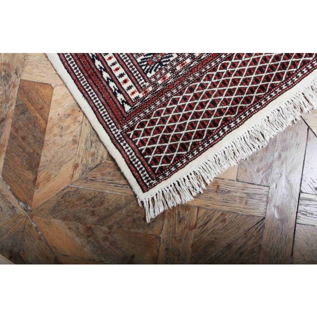 Hand-knotted Pakistani Bukhara rug with Tekke type gula. Fine wool on cotton warp. Weaving density around 360,000 knots...