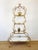 Vintage 1960s Gold Gilt Etagere made of metal gold gilt surface curvy tiered design with scroll detail acanthus leaves and...