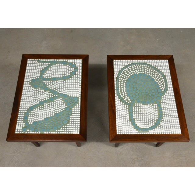 A pair of mid century modern walnut and tile top end tables. Professionally refinished. Circa 1960’s. Made in USA. 18”...