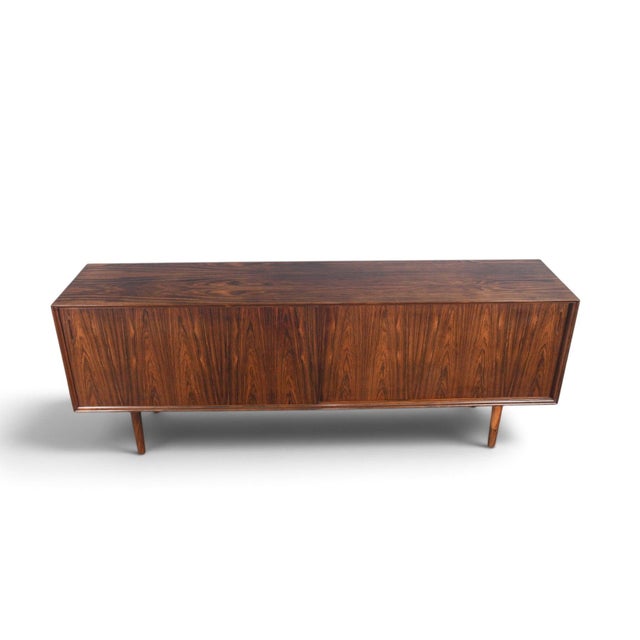 This low credenza was designed and produced by E. Pedersen and Søn in Denmark during the 1960s. The Brazilian rosewood...
