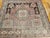 This early 20th century Turkish Oushak rug presents a rare and desirable near-square format — a proportion actively sought...