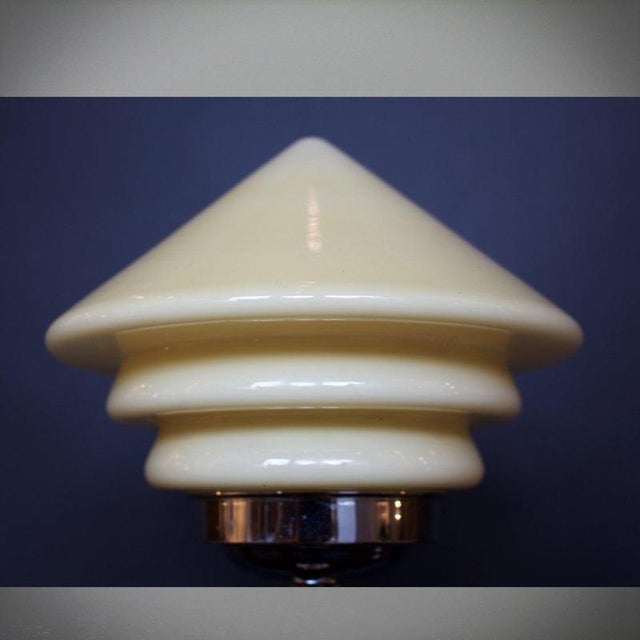 An Art Deco table lamp with shaped, chromed metal base and stem. Stepped, conical glass shade. Fully refurbished, re-wired...
