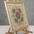 This framed antique textile artifact, dating from the 19th century, is crafted from a precious liturgical fabric or...