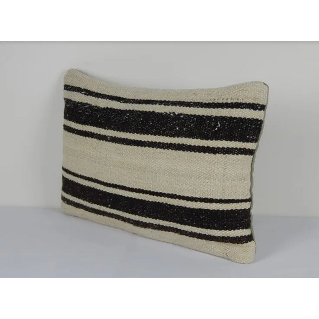 This turkish handwoven kilim pillow is made from Anatolia and Middleast Kilim fragments. Each of our kilim pillow cover is...
