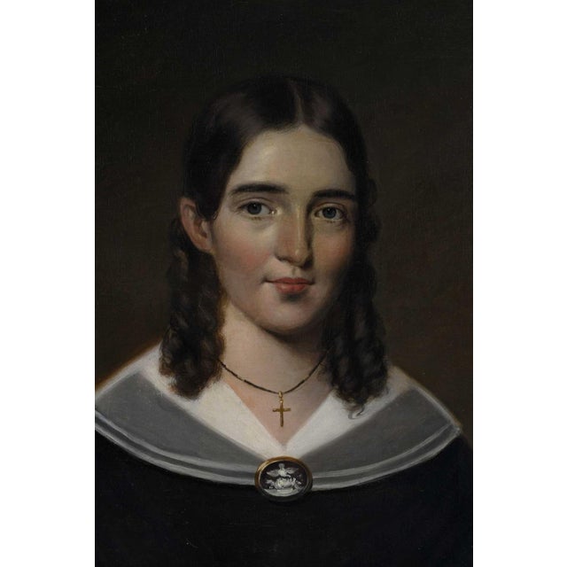(American, 19th century Young Lady with Cameo and Cross, unsigned, inscribed "Beecher" on stretcher, possibly Harriet...