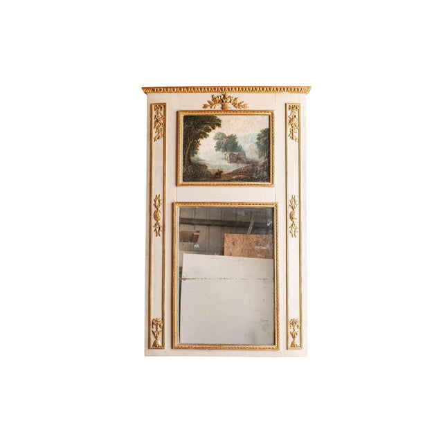 An 18th century French Louis XVI giltwood and painted trumeau mirror, elegantly combining classic neoclassical...