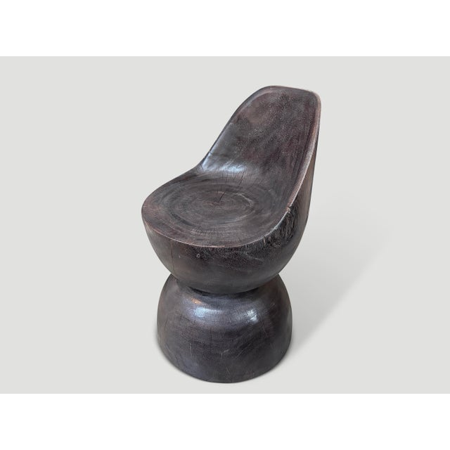 Beautiful chair hand carved from a single block of wood. Charred to an espresso tone revealing the unique wood grain. Both...