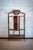 Rattan and Rush Étagère with Bevelled Glass Door – Dal Vera – 1910 Crafted in rattan and drawn and painted rush, featuring...