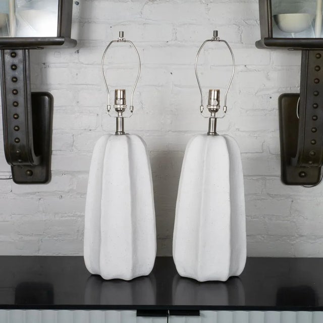 Pair of organic composition table lamps with channeled "carved stone" finish.