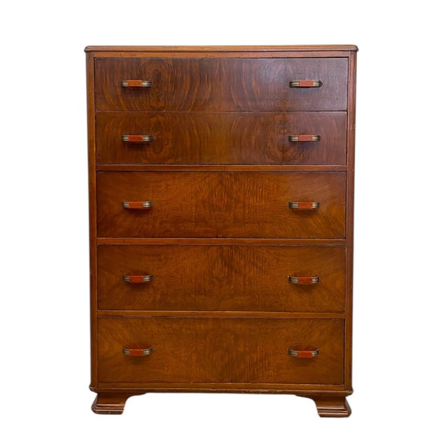 This vintage Art Deco highboy dresser features classic waterfall styling with beautifully figured veneer drawer fronts and...