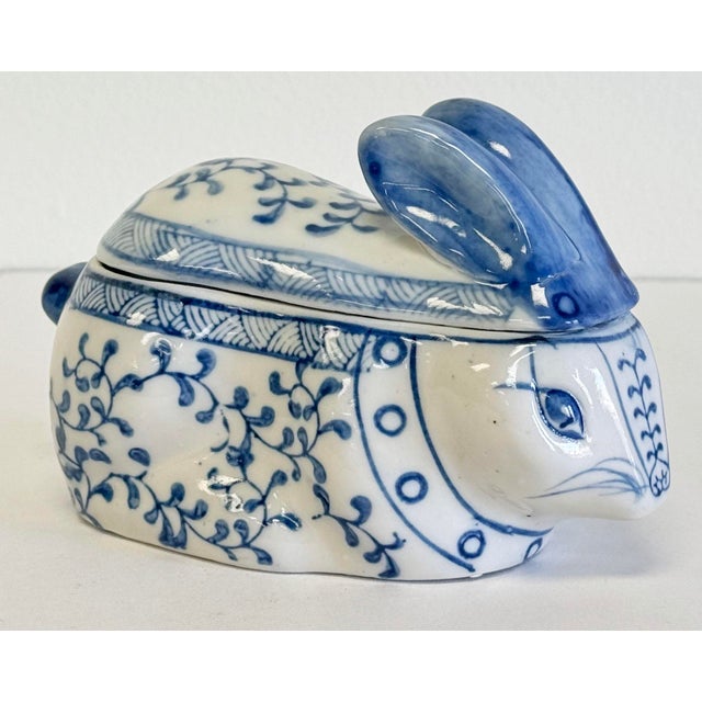 Vintage blue and white Asian motif bunny rabbit lidded ceramic box. Features wonderful hand-painted floral and Greek key...