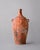 Evoking the quiet presence of an artifact unearthed from the Judean desert, this hand-sculpted vessel carries the...