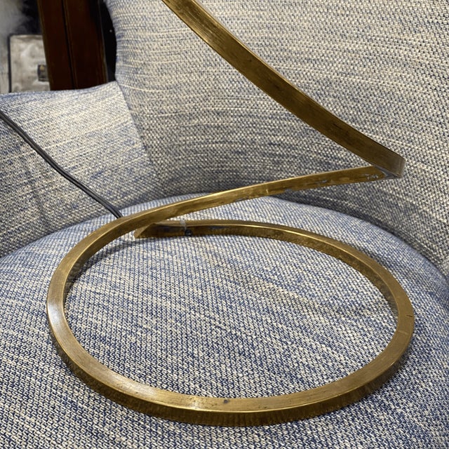 Magnificent and elegant golden brass table lamp. Inspired by nature, the leaf branch twists and supports the piece as a...