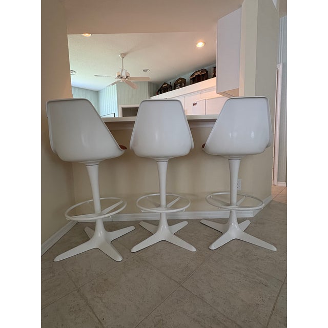 1960s design, rare set of Maurice Burke for Arkana barstools. Set of three swivel stools with original cushions, all in...