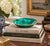 A beautifully proportioned brass rimmed malachite bowl in richly veined shades of green and black. The sculptural...
