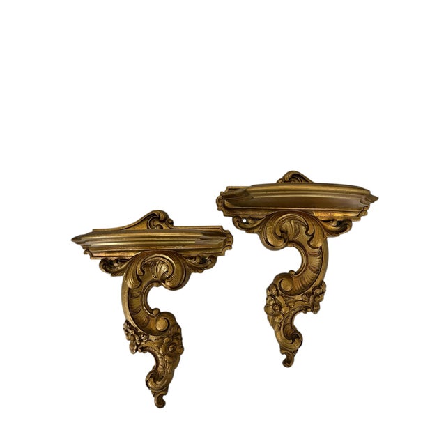 Offering this pair of mid century Syroco Wood gilt french style decorative wall brackets, display shelves. Each measures...