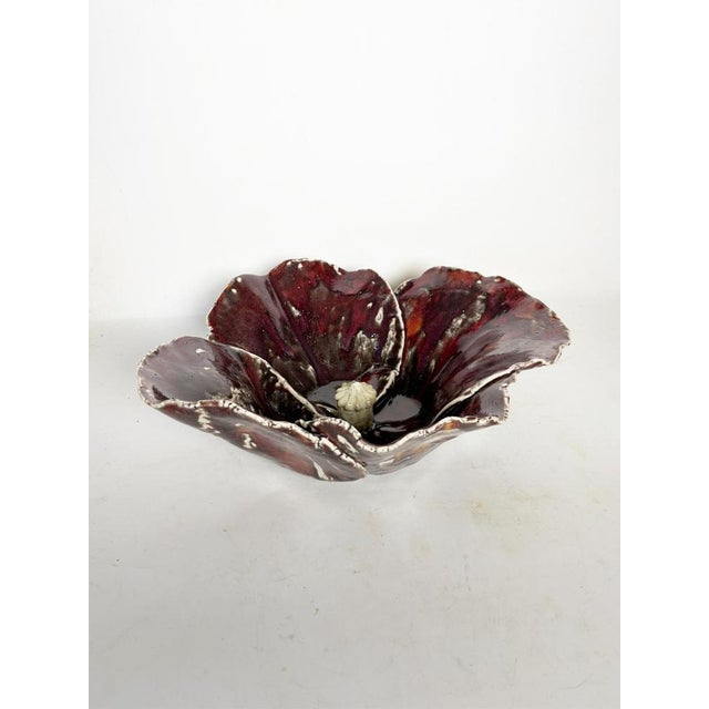 Red ceramic vase/bowl, France, circa 1970. This piece has an organic shape reminiscent of a cauliflower or a blooming...