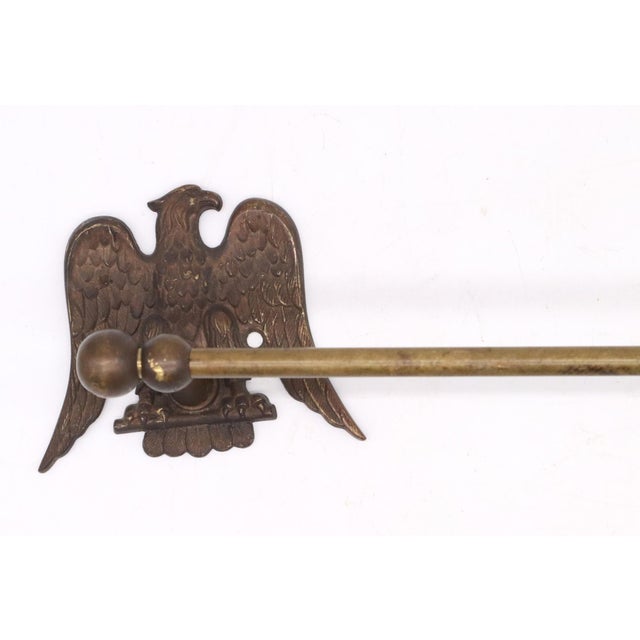Vintage brass adjustable towel bar with eagle motif wall brackets. The eagles are shaped like vintage American patriotism...