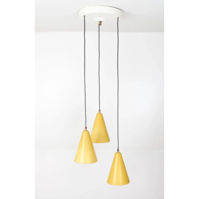 Very nice chandelier. Three aluminum perforated chalices. Original Yellow color. Adjustable in height. 1960s Italy. E27...