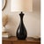Sleek and sculptural vintage black teardrop table lamp featuring a minimalist mid century modern silhouette. The tall,...