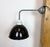 Industrial factory wall light made in former Czechoslovakia during the 1960s. It features a grey iron wall mounting and...