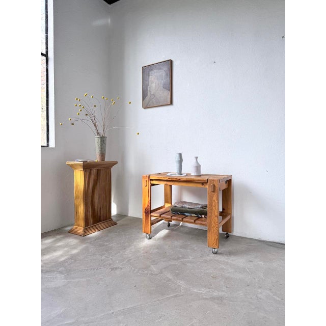 Vintage small pine serving cart or console table on casters from the 1970s/80s. we love its timeless look, with its simple...