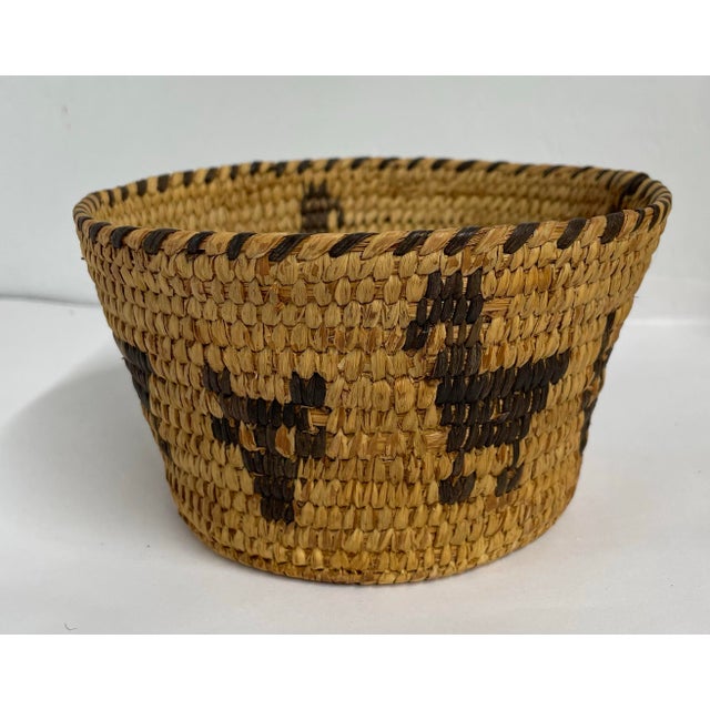 This fine American Indian Papago basket in good condition with pictorial designs.
