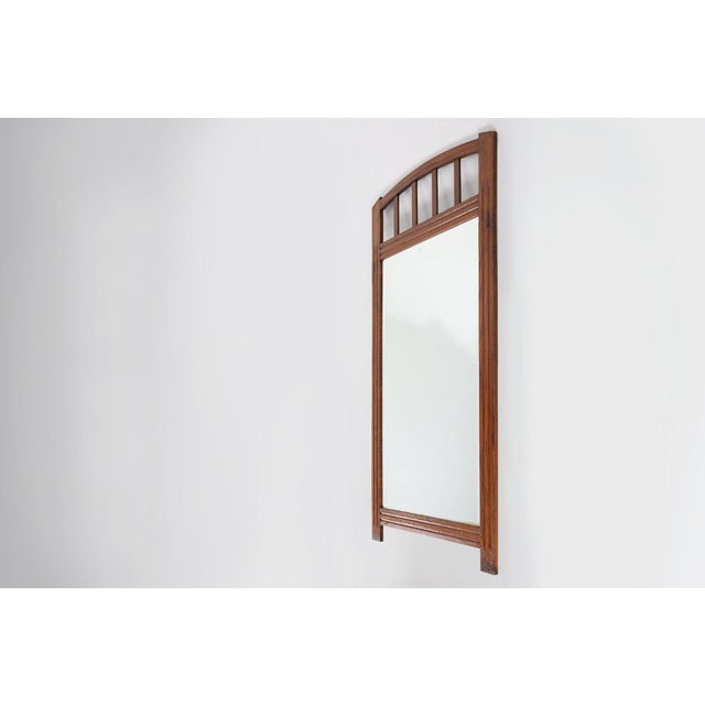 This elegant mirror from Belgium, dating to around 1930, exemplifies the refined geometry and craftsmanship of the Art...
