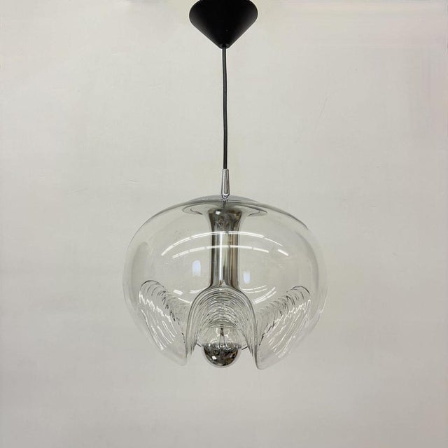 A special round Biomorphic glass pendant designed by Koch & Lowy for Peill & Putzler, manufactured in Germany, circa...