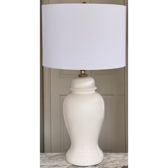 In a designer's favorite form, we present a creamy white vintage ceramic ginger jar lamp with original brass connectors...