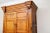 An imposing antique pine cabinet with rich caramel hues, fine graining, wonderful patina and brass hardware. The cabinet...