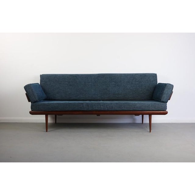 Gorgeous and highly collectable sofa / daybed designed by Peter Hvidt and Orla Molgaard-Nielsen. Remove the perfectly...