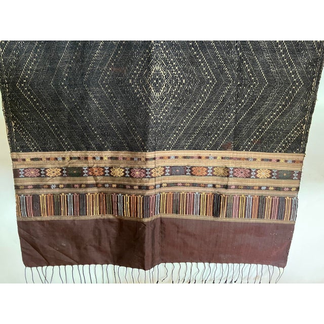 This excellent example of Pha Biang is comprised of 100% silk & 100% cotton threads, and was handspun, -dyed, and -woven...