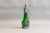 Green glass claret jug with decorative metalware handle and stopper. Circa 1900.