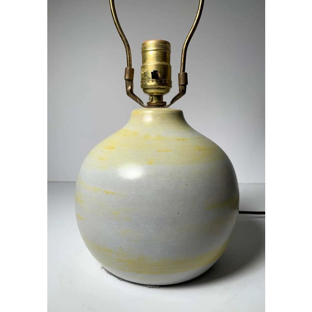 Gordon Martz table lamp white with yellow swirls.