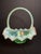 This large, vintage Fenton Art Glass Bride’s Basket is pressed in the iconic Hobnail pattern using a vibrant translucent...