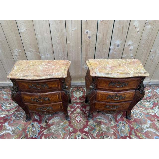 Pair of small Louis XV style chests of drawers or bedside tables, dating from the 1950s, with a bombé front and three...