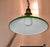 green enamel cone shaped hanging lamp. brass fittings and chain . shade is 10" across at base