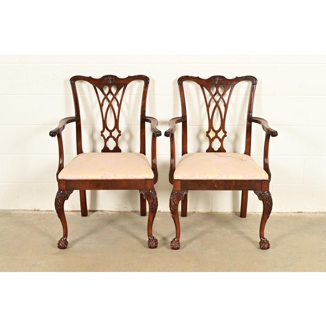 An outstanding pair of Chippendale or Georgian style armchairs or dining captain chairs In the manner of Baker Furniture...