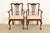 An outstanding pair of Chippendale or Georgian style armchairs or dining captain chairs In the manner of Baker Furniture...
