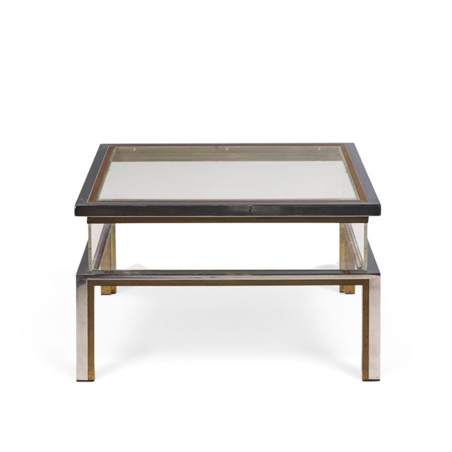 Romeo Rega Mid Century Chrome, Brass and Glass Coffee Table This coffee table measures: 29.5 wide x 29.5 deep x 17.75...