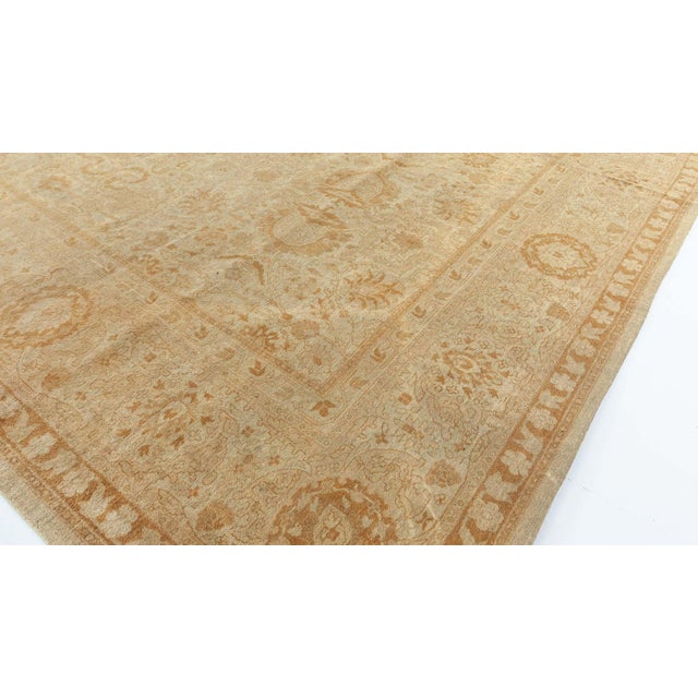 This imposing antique Indian rug (Amritsar Rugs Collection) comes from the iconic weaving center of Amritsar located in...