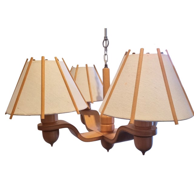 A four-arm pendant chandelier designed by Jan Wickelgren and produced by Aneta, Sweden, 1970s. The frame is constructed in...