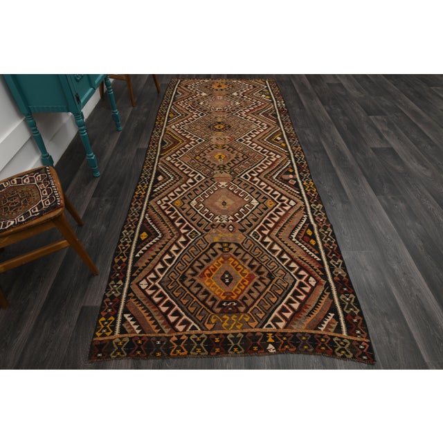 Vintage Turkish Hand-Knotted vintage rug is a semi-antique vintage area rug.'70s Eastern region of Turkey's unique rug is...