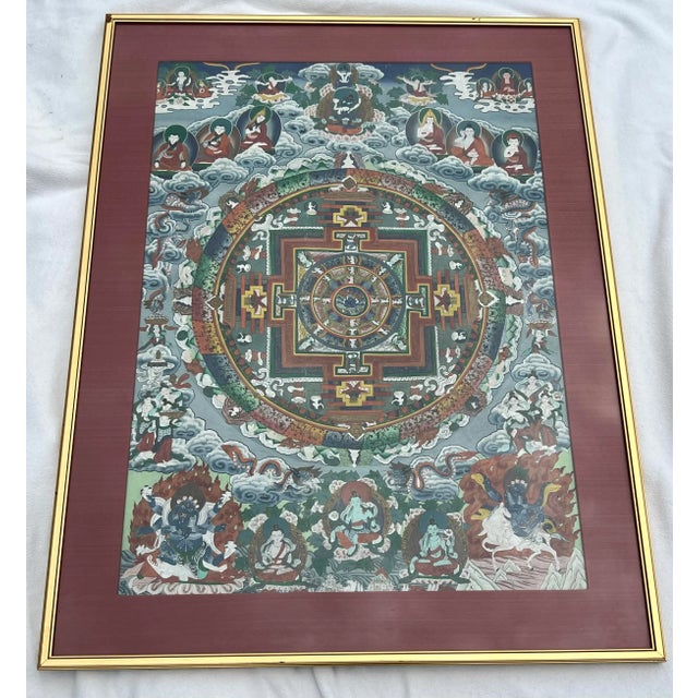 This mesmerizing thangka, a vibrant tapestry of Tibetan Buddhist iconography, invites us to contemplate the cosmic order...