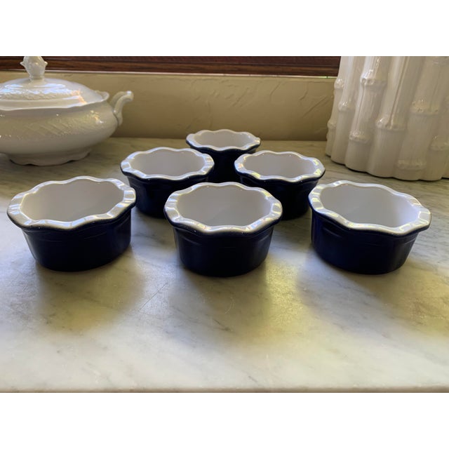 Here we have a set of six vintage French blue custard ramekins. These were made in France by Emile Henry, a family owned...